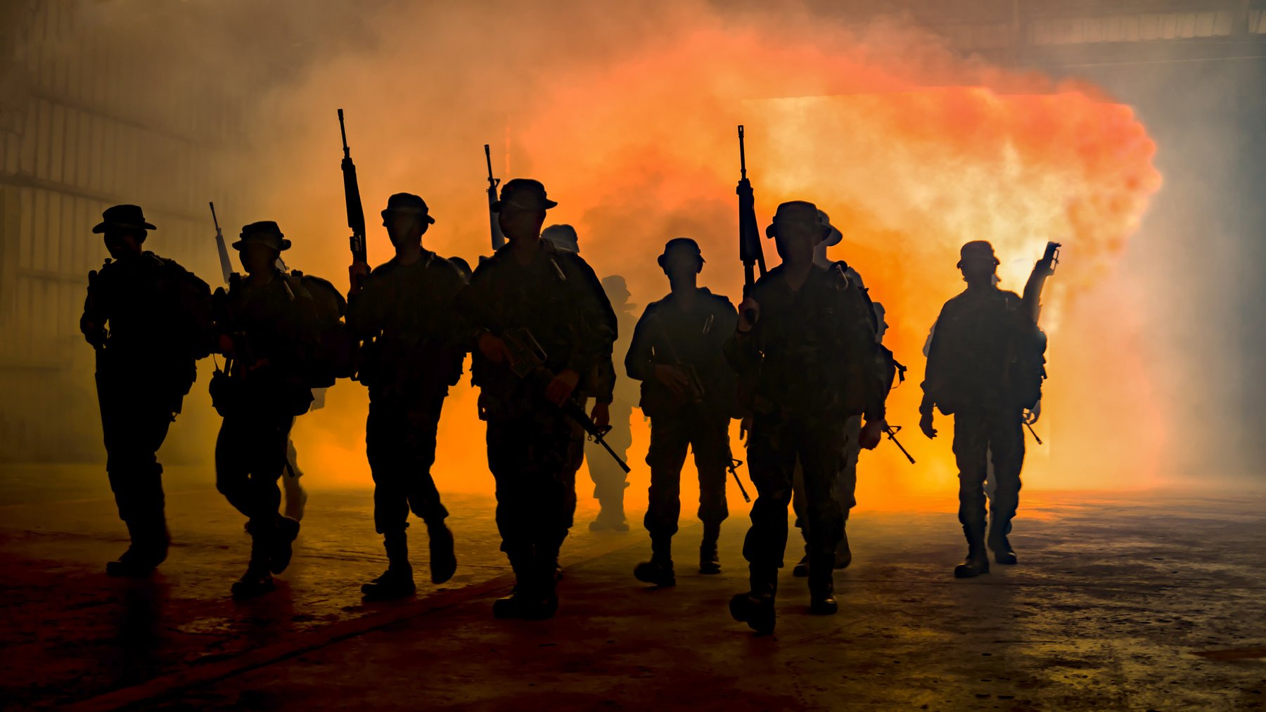 Military Soldiers Walking Away from the Fire 